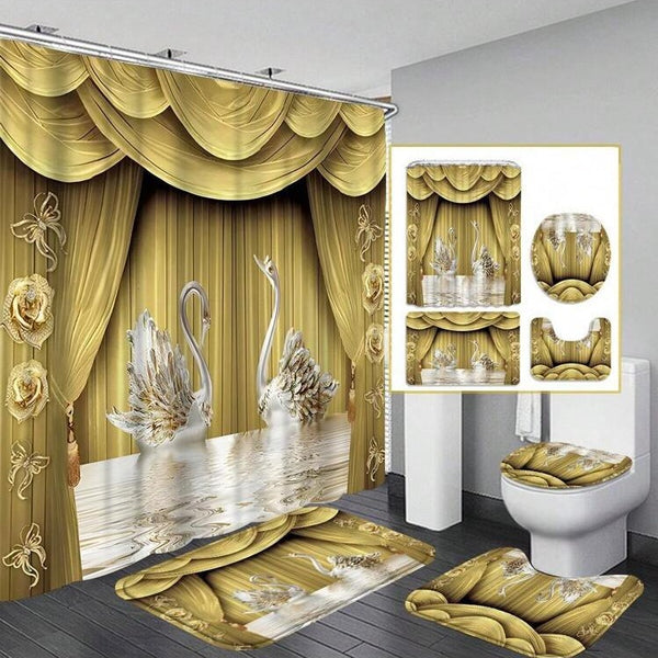 Gold and white three-piece bathroom mat set with a swan and floral design, including a bath mat, contour mat, and toilet lid cover.