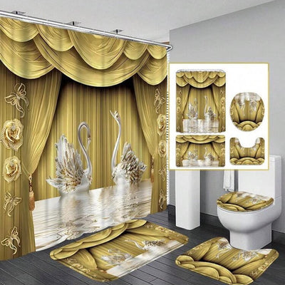 Gold and white three-piece bathroom mat set with a swan and floral design, including a bath mat, contour mat, and toilet lid cover.