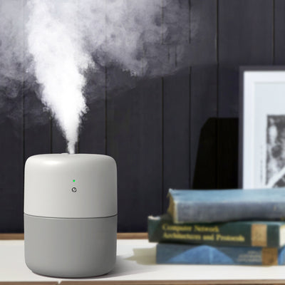 Coral desktop humidifier with a modern cylindrical design, featuring a green indicator light and a power button. - Image 9