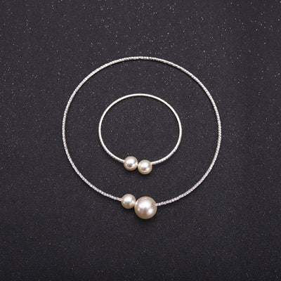 Elegant silver-tone choker necklace with a single row of clear rhinestones and two white faux pearls of varying sizes. - Image 2