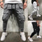 Pantalones deportivos slim fit con bolsillos de cierre