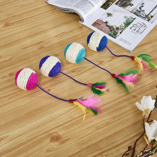 Four sisal ball cat toys with colorful feathers in pink, purple, blue, and teal stripes, for playing and grinding claws.