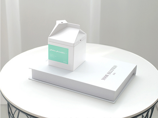 Pink milk carton shaped humidifier with a white label, featuring "Milkbox Humidifier" text and a bcase logo. - Image 7