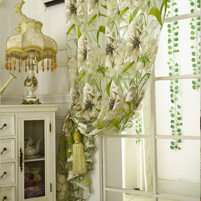 White sheer curtains with a green and beige floral pattern, hanging on a rod in a bright room. - Image 11