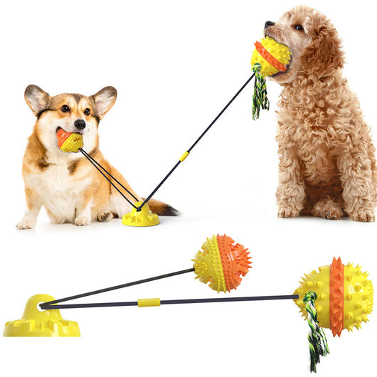 Red, white, and blue textured dog chew toy with rope tassels and a blue suction cup base, shown with a Dalmatian puppy playing. - Image 6