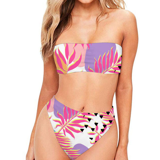 Dark blue two-piece bikini with strapless bandeau top and high-waisted bottom, featuring a tropical leaf and floral print.