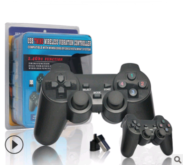 Black wireless game controller with dual analog sticks, D-pad, and colored face buttons, shown with its retail packaging and a USB dongle.