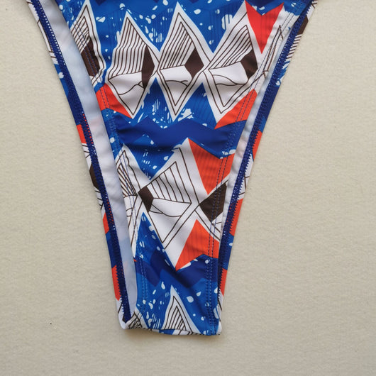 Red, white, and blue geometric print bikini with a triangle top and high-waisted, high-cut bottom. - Image 5