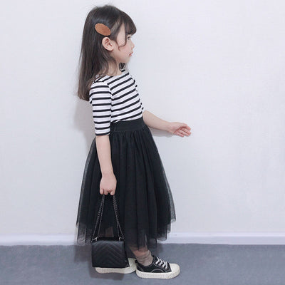 Children's two-piece dress with a black and white striped short-sleeve top and a black gathered tulle skirt. - Image 6