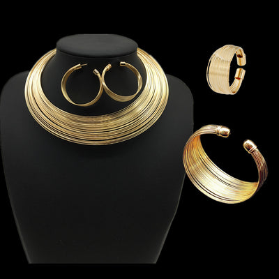 Silver-tone multi-strand choker necklace, hoop earrings, cuff bracelet, and ring set on a black mannequin.
