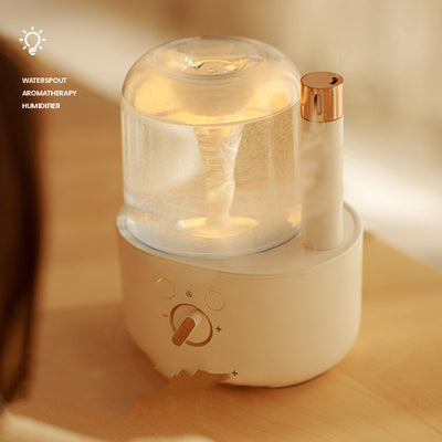 White and clear humidifier with a visible water vortex, emitting mist, and featuring a rose gold accent. - Image 11