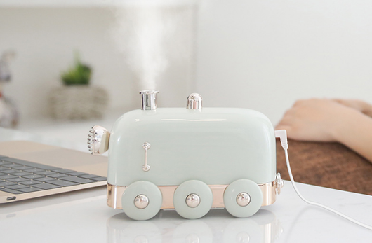 Pink retro mini train ultrasonic humidifier and aroma diffuser with rose gold accents on a white background. - Image 4