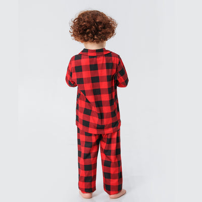 Baby in a red and black buffalo plaid long-sleeve pajama romper, viewed from the back with arms raised. - Image 22