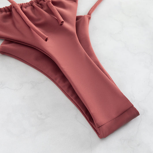 Red bean paste women's bikini swimwear with a triangle top and high-cut double-strap bottoms, laid flat. - Image 18