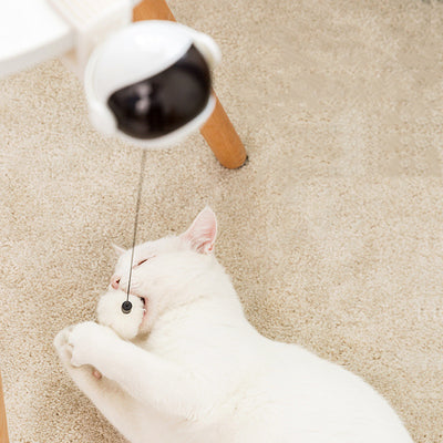 Pink automatic lifting cat toy with a black visor-like front, a clamp, and a white fluffy ball on a string. - Image 14