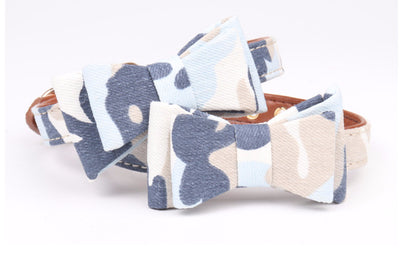 Two pet collars with blue, white, and tan camouflage bowknots and brown lining on a white background. - Image 6