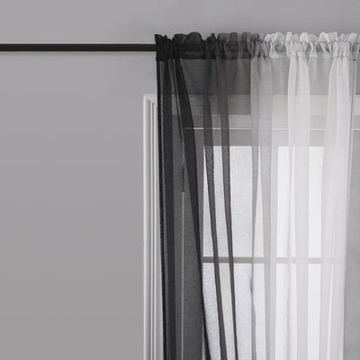 Pink and white gradient sheer rod pocket curtain panels hung on a black rod in front of a window. - Image 2