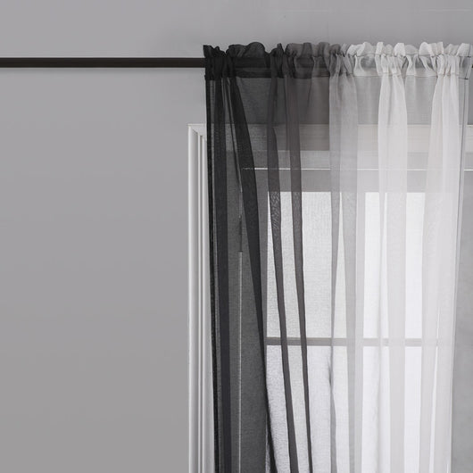 Pink and white gradient sheer rod pocket curtain panels hung on a black rod in front of a window. - Image 2