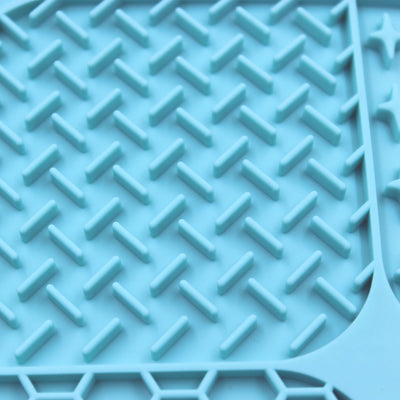 Gray silicone pet licking pad with four textured sections, designed for slow feeding and anti-choking. - Image 34