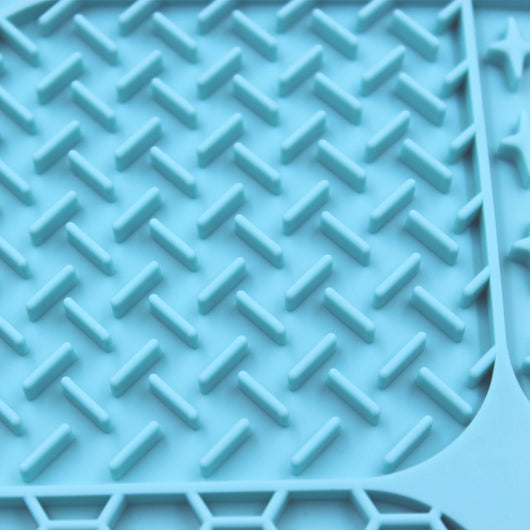 Gray silicone pet licking pad with four textured sections, designed for slow feeding and anti-choking. - Image 34