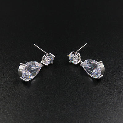 Sparkling bridal jewelry set with a silver-tone crown, necklace, and teardrop earrings, adorned with clear crystals. - Image 4