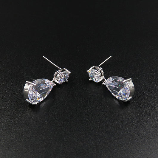 Sparkling bridal jewelry set with a silver-tone crown, necklace, and teardrop earrings, adorned with clear crystals. - Image 4