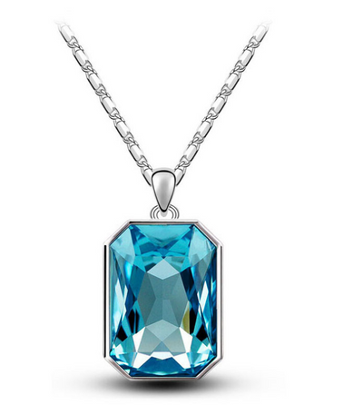 Teal rectangular crystal necklace and matching stud earrings set with silver-toned settings and chain. - Image 10