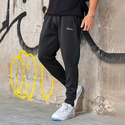 Pantalones de Chándal con Bolsillos de Cierre y Tela Elástica - Image 10