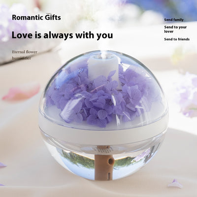 Pink round mini humidifier with clear dome, decorative pink flowers, and a light-up base, ideal for desktop or bedroom. - Image 4