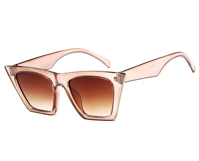 Transparent nude cat-eye sunglasses with brown gradient lenses, featuring a vintage 90s fashion style for women. - Image 6