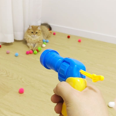 Colorful pompom balls and a yellow and blue toy launcher, a fun set for cats or kids. - Image 5
