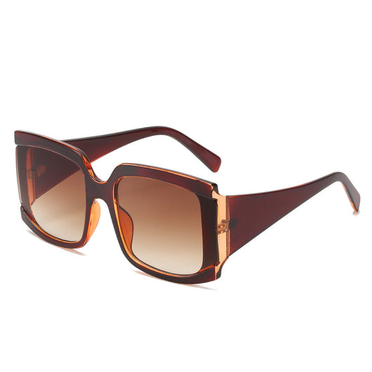Oversized square-frame sunglasses with a light pink frame and gradient lenses transitioning from purple to orange to yellow. - Image 5
