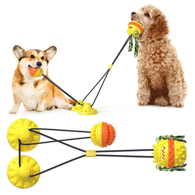 Red, white, and blue textured dog chew toy with rope tassels and a blue suction cup base, shown with a Dalmatian puppy playing. - Image 29