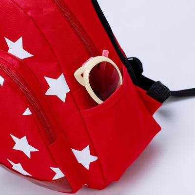 Blue kids' backpack with white stars, front pocket, side pockets, and a detachable bear coin purse. - Image 2