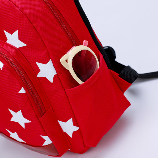 Blue kids' backpack with white stars, front pocket, side pockets, and a detachable bear coin purse. - Image 2