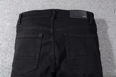 Jeans Negros con Detalles de Bigotes de Gato - Image 2