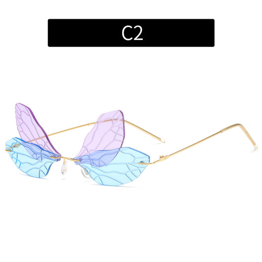 Light green rimless butterfly sunglasses with gold metal frames, featuring a unique veined lens design. - Image 6