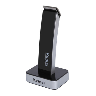 White and silver Kemei Professional Trimmer electric hair clipper with charging base.