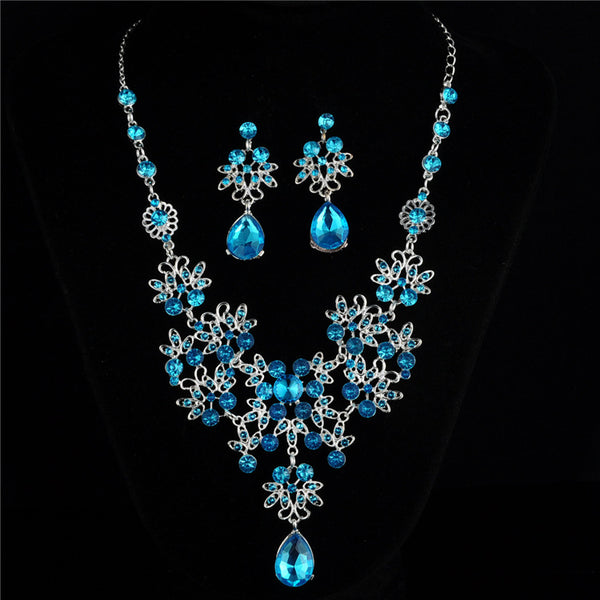 Silver-tone necklace and matching drop earrings set with clear rhinestones and teardrop crystals, ideal for weddings. - Image 7