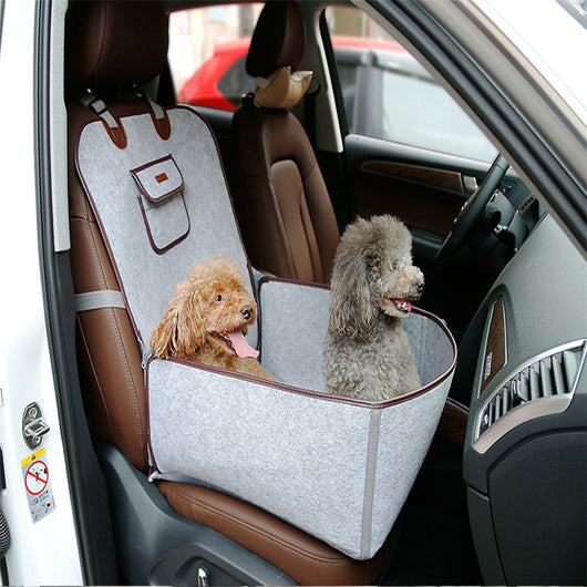 Light grey pet car seat with brown trim on a car's front passenger seat, holding two small dogs. Includes a black pet seatbelt tether. - Image 8
