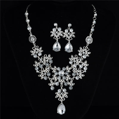 Silver-tone necklace and matching drop earrings set with clear rhinestones and teardrop crystals, ideal for weddings. - Image 6