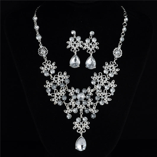 Silver-tone necklace and matching drop earrings set with clear rhinestones and teardrop crystals, ideal for weddings. - Image 6