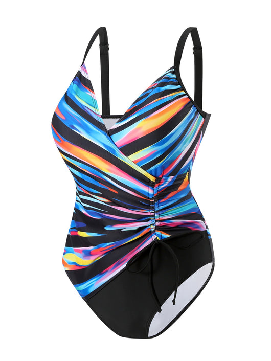 Woman in a navy and white striped tankini swimsuit with a wrap-front and side drawstring, holding a woven bag. - Image 23