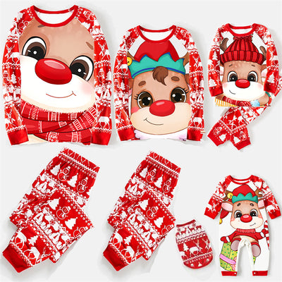 Baby wearing a red and white Christmas pajama set with a fawn graphic, sitting on a white blanket. - Image 21