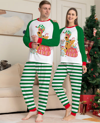 Woman wearing green and white striped holiday pajamas with a Scooby-Doo "Happy Holidays!" graphic on the top. - Image 2
