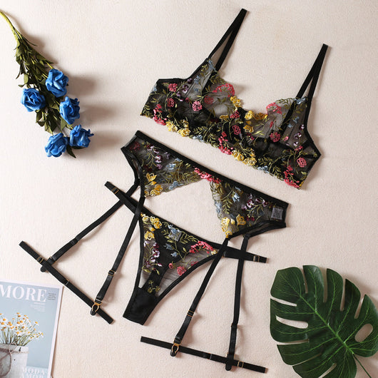 Yellow sheer floral embroidered lingerie set with a bra, thong, and two leg rings, laid flat. - Image 12