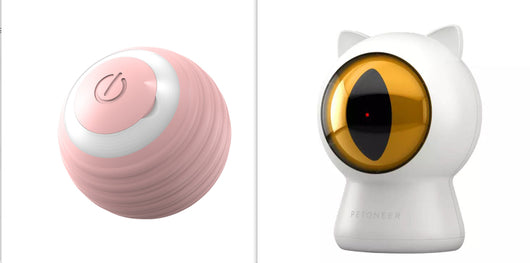 White cat-shaped laser toy with gold eye and red light, alongside a light blue smart rolling ball cat toy. - Image 7