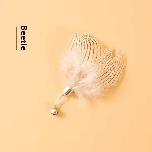 Three distinct feather cat toy replacement heads: a light 'Beetle', a brown and yellow 'Yellowtail flycatcher' with pom-poms, and a multi-colored 'Dead leaf but - Image 5