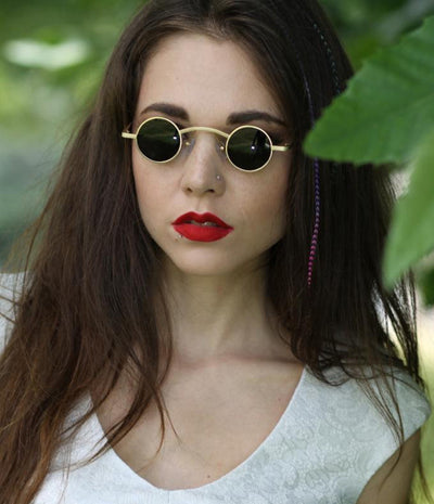 Small frame retro round sunglasses with black metal frames and brown polarized lenses, angled on a white background. - Image 2