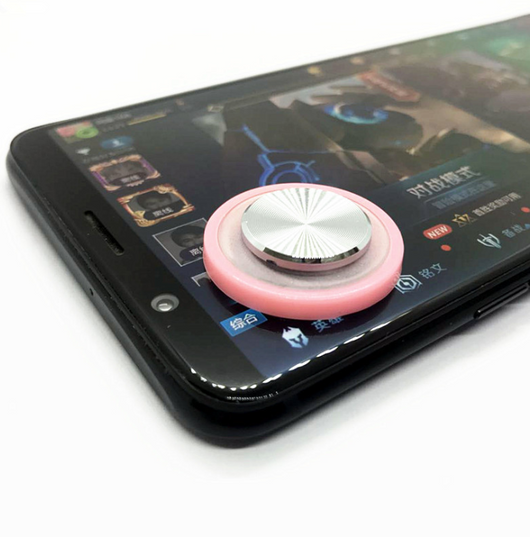 Pink and silver mobile game joystick attached to a black smartphone displaying a game on its screen. - Image 11